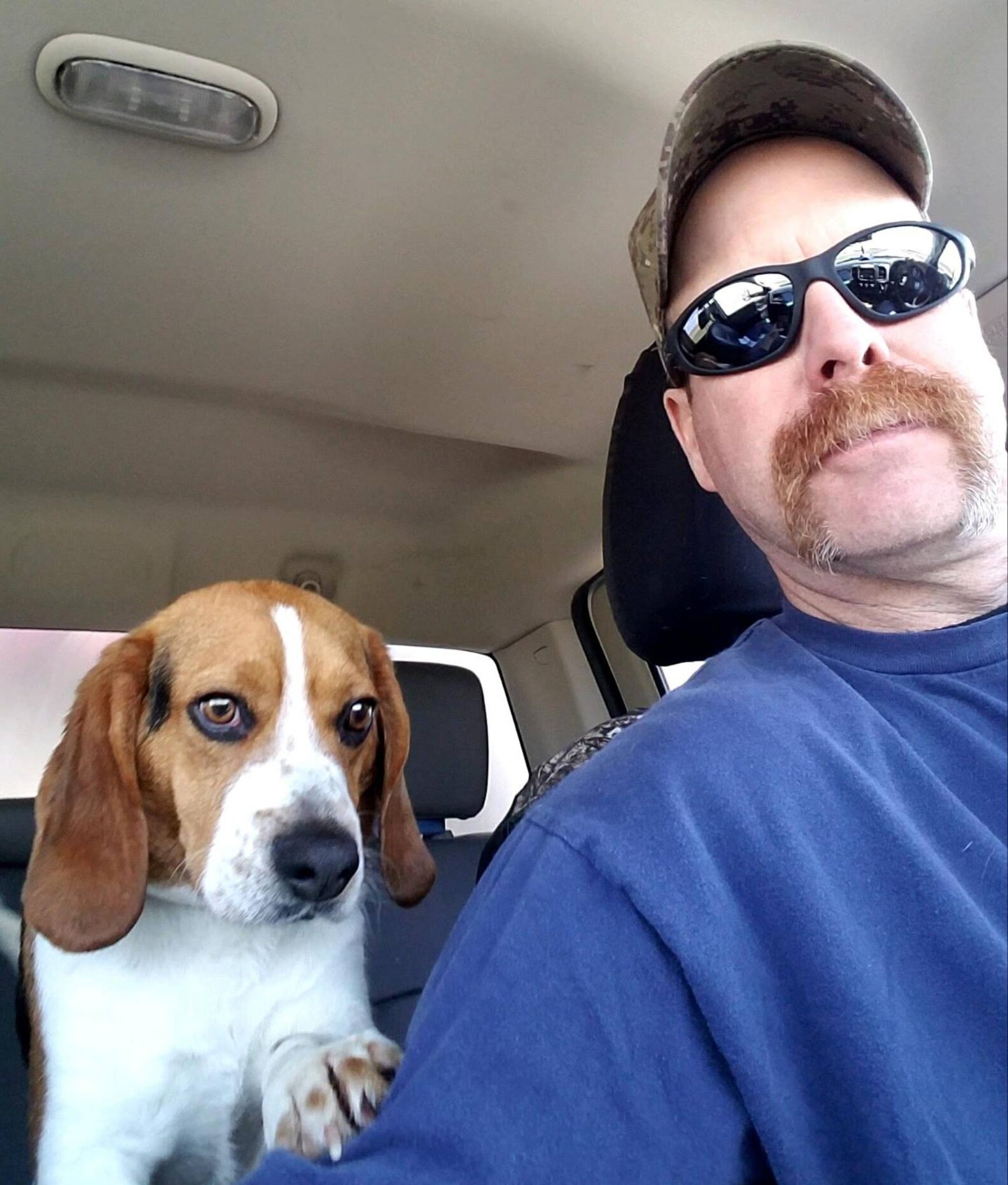 Gregory the dog snuggles his rescuer on his Freedom Ride