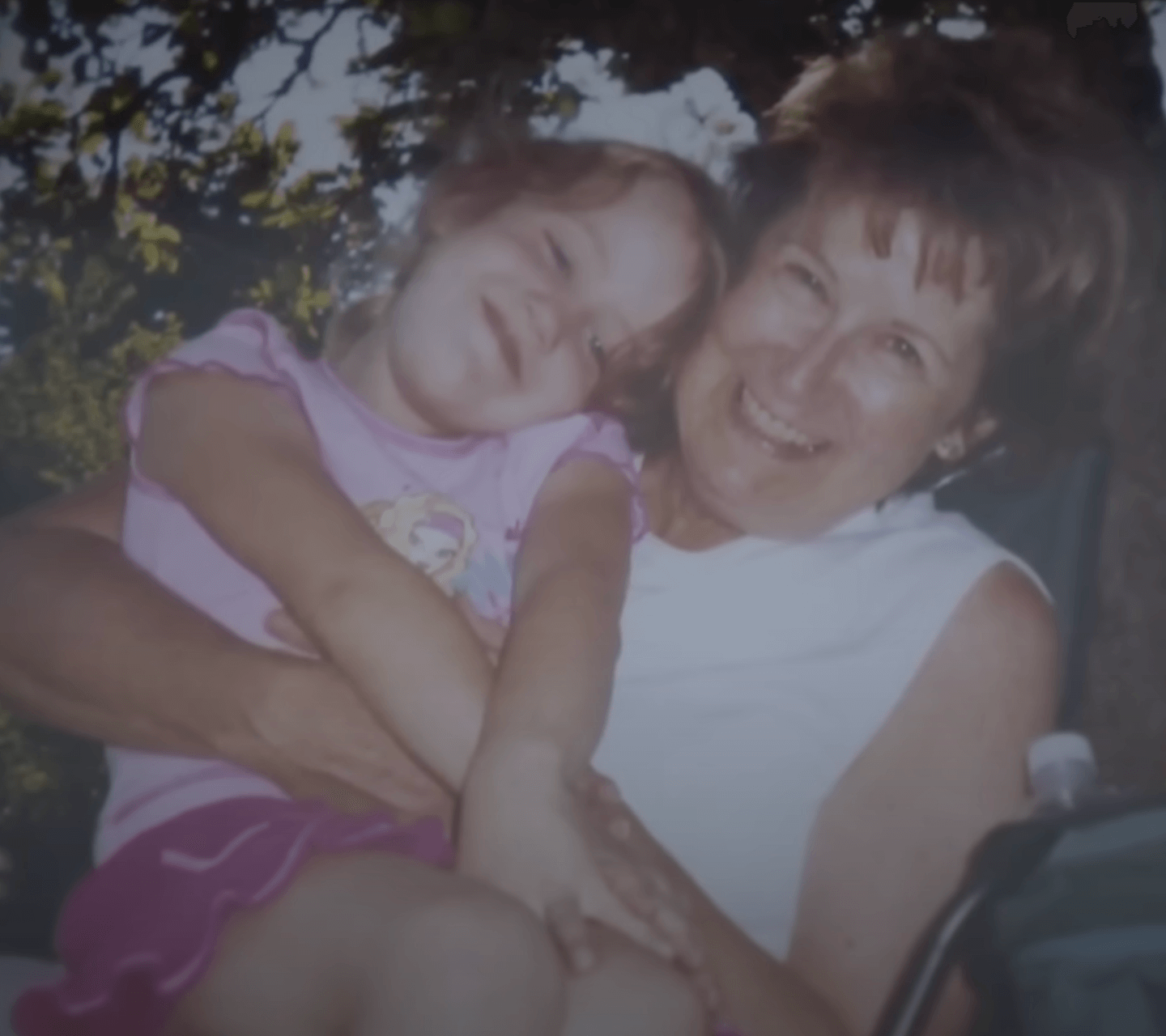 Lane pictured when she could see prior to the auto-immune disorder, decades ago with her daughter 
